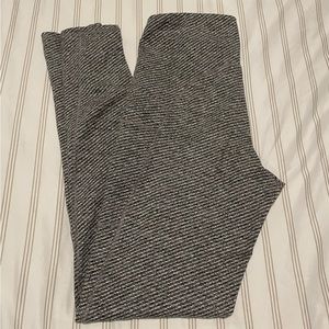 Grey and white striped, high waisted leggings.